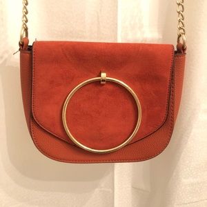 rust colored suede purse with gold chain strap